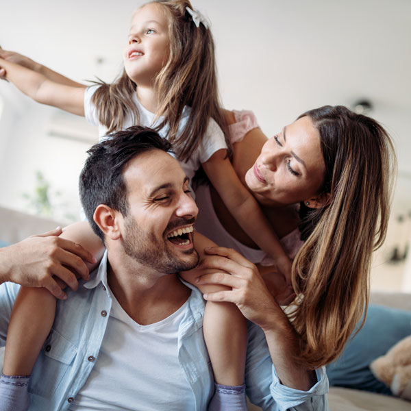 young family having fun in home